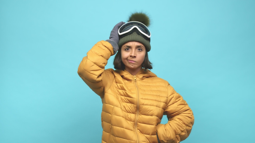 Young snowboard indian woman being shocked, she has remembered important meeting Royalty-Free Stock Footage #1061851855