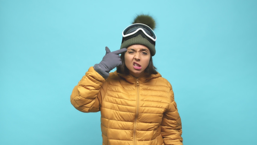 Young snowboard indian woman showing a disappointment gesture with forefinger Royalty-Free Stock Footage #1061851858