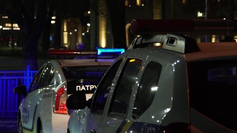 Kyiv, November 4, 2020 , - Police lights flash at night. Two patrol cars