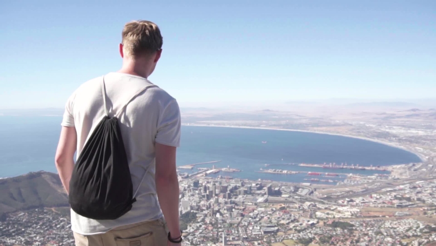 Slow Motion: Man on Table Mountain Enjoys Beautiful View of Cape Town