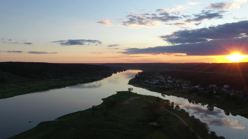 Confluence of two rivers Nemunas and Nevezis, Kaunas, Lithuania. Drone aerial view. Sunset moment.