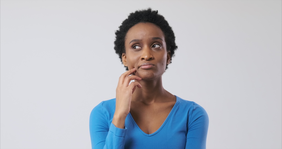Confused woman coming up with a good idea | Shutterstock HD Video #1061869699