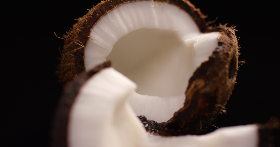 Fresh coconut rotating on a black background. | Shutterstock HD Video #1061890918