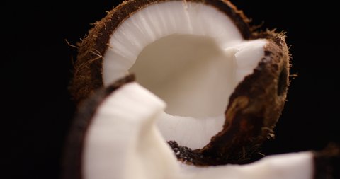 Fresh coconut rotating on a black background.