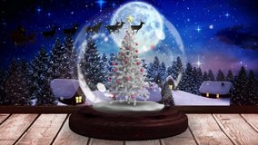 Digital animation of shooting stars spinning around christmas tree in snow globe on wooden surface against silhouette of santa claus in sleigh being pulled by reindeers against moon in night sky. - Powered by Shutterstock - Get 15% off with code: PIKWIZARD15