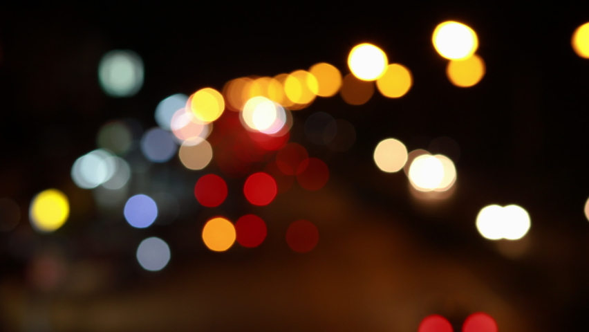 4K UHD Video blurred on the road superhighway at night, bokeh light of the car headlights reflects a beautiful and colorful look. | Shutterstock HD Video #1061899534