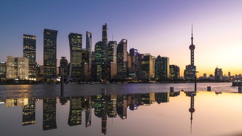 4K Timelapse - Uraban skyline and cityscape at sunset in Shanghai China.