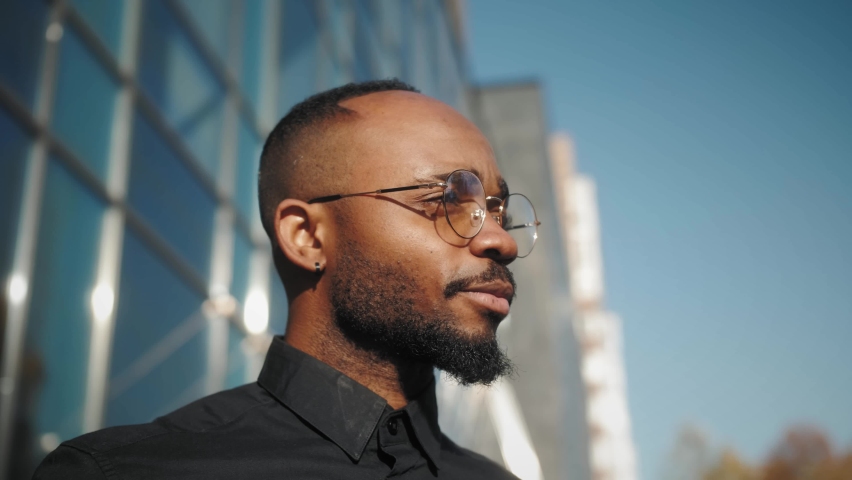 Portrait Charming Black Man in Eyeglasses. Pensive Elegant Businessman Looking at Camera Close Up. Confident Professional African American Person in Glasses. Royalty-Free Stock Footage #1061907181