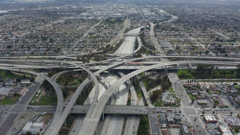 AERIAL: Spectacular Judge Pregerson Interchange showing multiple Roads, Bridges, Highway with little car traffic in Los Angeles, California on Beautiful Sunny Day 