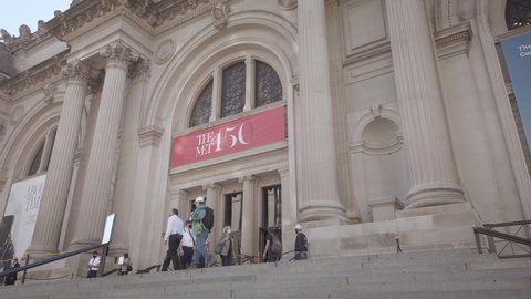 New YorK City / USA - Nov 11, 2020: The Metropolitan Museum of Art Building exterior during Coronavirus (Covid-19) reopening / recovery phases. The MET 150 Logo above entrance. Steps in foreground.