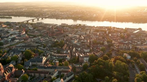 Rising up drone shot of Mainz by a cine drohne with lensflares on a sunny summer morning in Germany