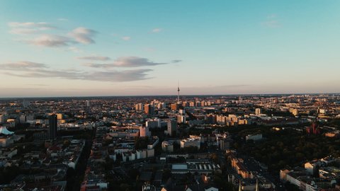 Berlin Skyline aerial drone shot of the capital city of Germany, Fernsehturm in the middle, metropole town, pulling backwards, Slow Motion