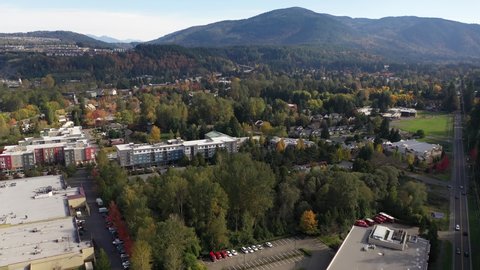 Aerial / drone footage of Issaquah, Olde Town, Newport, Tiger Mountain, the I-90 highway, commercial area, Lake Sammamish and surrounding suburbs in King County, Washington