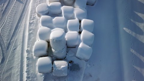 The white marshmallow like hays on the ground filled with snow on a winter season in Finland