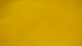 Macro slow motion video of pouring brown honey, healthy vegetarian food texture