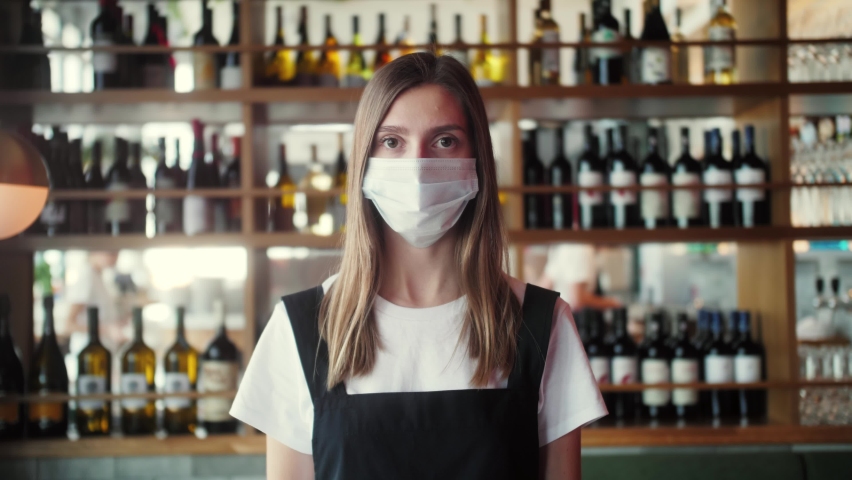 Coffee Shop restaurant Woman Owner Working With Face Mask, Open After Lockdown coronavirus Quarantine is over. business owner waiter waiting customers, supermarket food store, wine shop Royalty-Free Stock Footage #1061925055