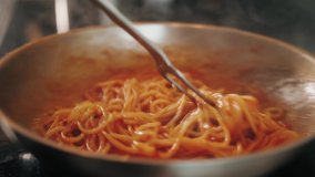 Chef cooking bolognese fresh pasta with tomato sause, man making traditional italian dinner on restaurant kitchen, tasty food, high haute kitchen  - Powered by Shutterstock - Get 15% off with code: PIKWIZARD15