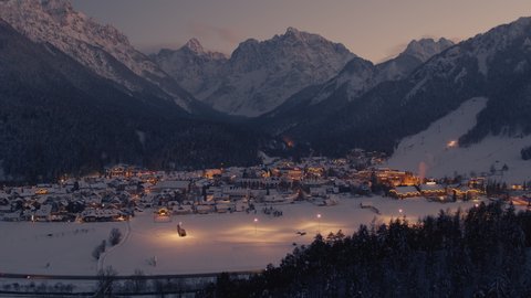 Beautiful night drone video of a ski resort in Kranjska gora, with mountains in the background