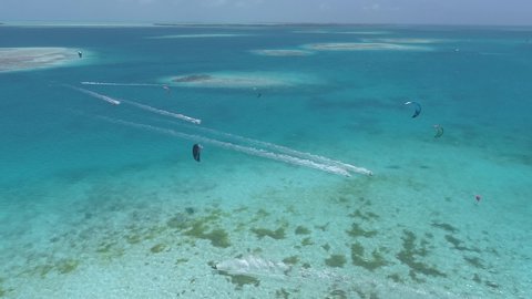 Aerial View Of Group Kitesurfing competition in a paradisiac beach. Los Roques, Venezuela
