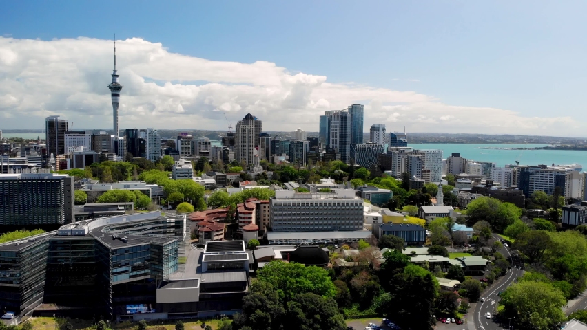 Auckland CBD aerial cityscape of Sky Tower, skycrapers and city parks. Sunny day, in a large metropolitan city. New Zealand