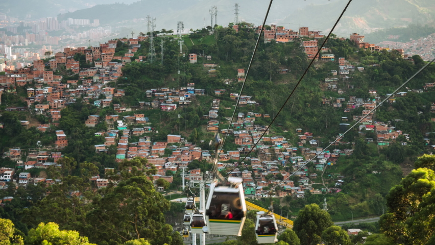 Time lapse view of metro cable car public transit system and Medellin cityscape at sunset, Antioquia Department, Colombia.
