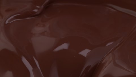 Super Slow Motion Detail Shot of Swirling Melted Chocolate at 1000 fps.