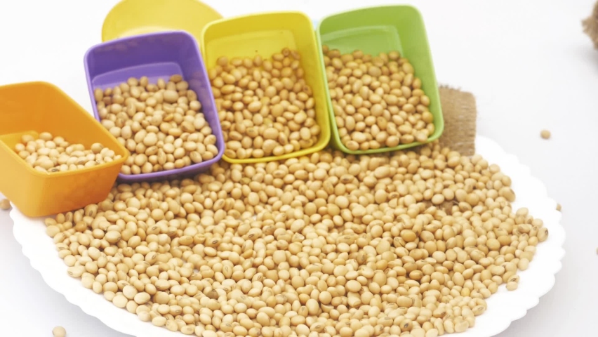 man hand pick up some beans in a plate with decorated background