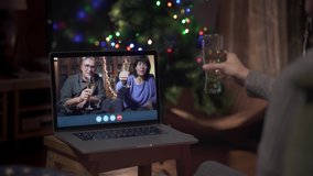 Family celebrating new year's through a video call. Family making a toast online through the computer. Christmas social distance. Coronavirus Confined Holidays. Quarantine and Isolation. 
 - Powered by Shutterstock - Get 15% off with code: PIKWIZARD15