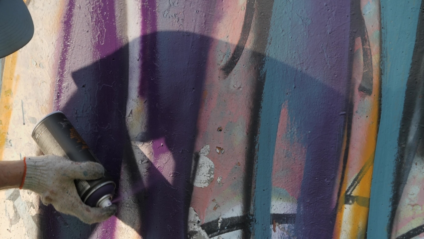 Artistic painting of walls on the street. Graffiti.