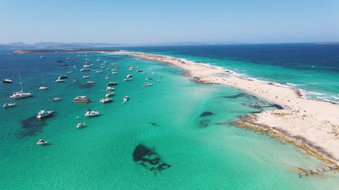 Aerial View of many yachts in a bay on Formentera island. Yachting in the Balearic islands around Ibiza