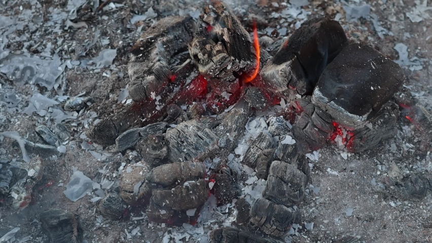 Word Store on a white sheet of paper burns into a fire against. Slow motion