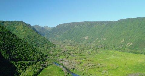 4k forward tracking aerial view of the Waipio valley, this valley offers lush landscapes, walking paths, waterfalls & elevated lookouts with sweeping sea vistas on Big Island, Hawaii, usa