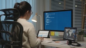 Back rear view of young asian woman, freelance data scientist work remotely at home coding programming on Big data mining, AI data engineering, IT Technician Works on Artificial Intelligent Project. - Powered by Shutterstock - Get 15% off with code: PIKWIZARD15