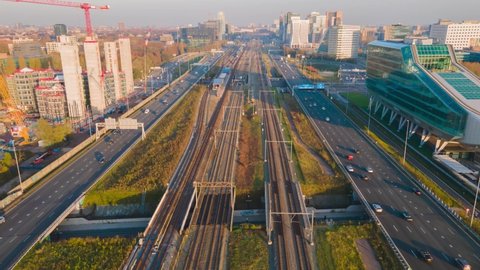 Hyperlapse of Amsterdam highway and railway flying over drone shot transportation infrastructure