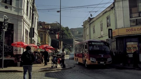 Valparaiso / Chile - March 2020: Street Market and Public Bus in Valparaiso, Chile.