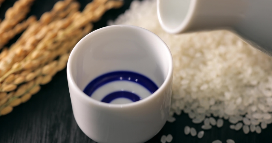 Pour sake into a Japanese sake cup (Slow motion)