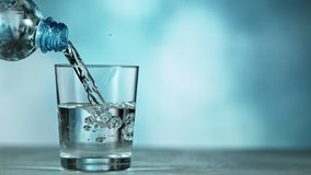 Super slow motion of pouring water from bottle into glass. Filmed at 1000 fps. - Powered by Shutterstock - Get 15% off with code: PIKWIZARD15