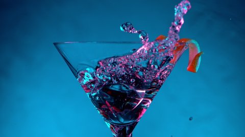 Super Slow motion shot of ice cube splashing into Dry Martini Drink, 1000 fps