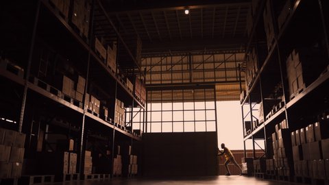 Workers open the warehouse door