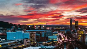 Oslo, Norway. A night view of the Sentrum area of Oslo, Norway, with modern and historical buildings and car traffic. Sunset colorful sky in summer with car traffic, time-lapse, panning video