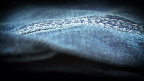 Blue denim jeans material close up stock footage