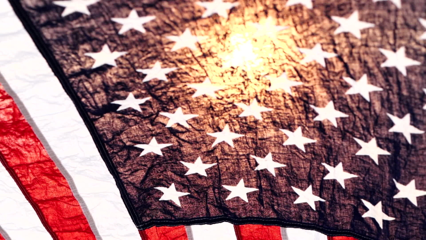 Close up American flag waving on sunset with soft focus, Slow Motion. Concept of Memorial Day or 4th of July, Independence Day, Veterans Day, Celebrate USA, American Election. America Concept. Royalty-Free Stock Footage #1061999302