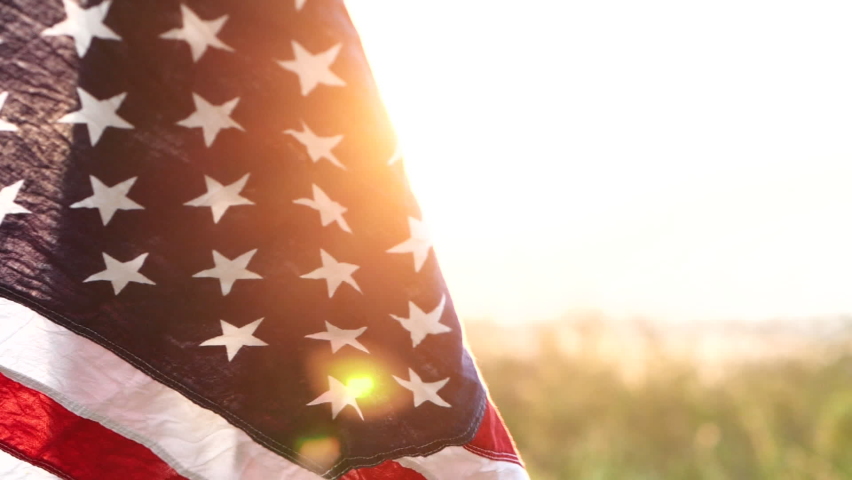 Close up American flag waving on sunset with soft focus, Slow Motion. Concept of Memorial Day, 4th of July, Independence Day, Veterans Day, Celebrate USA, American Election, America, Labor , Sun Flare | Shutterstock HD Video #1061999305