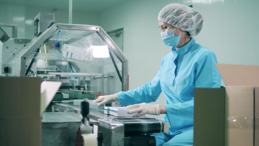 Drug packaging process. Health care, drugs production, pharmacist working, pharmaceutical manufacturing, pharmaceutical industry concept. Royalty-Free Stock Footage #1062003319