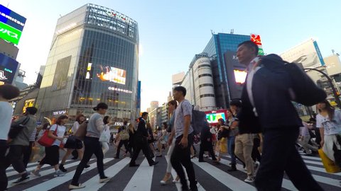 Tokyo, Japan - May 14, 2015: Pedestrians at Shibuya crossing, The famous scramble crosswalk also known as Shibuya scramble is used by over 2.5 million people on daily basis