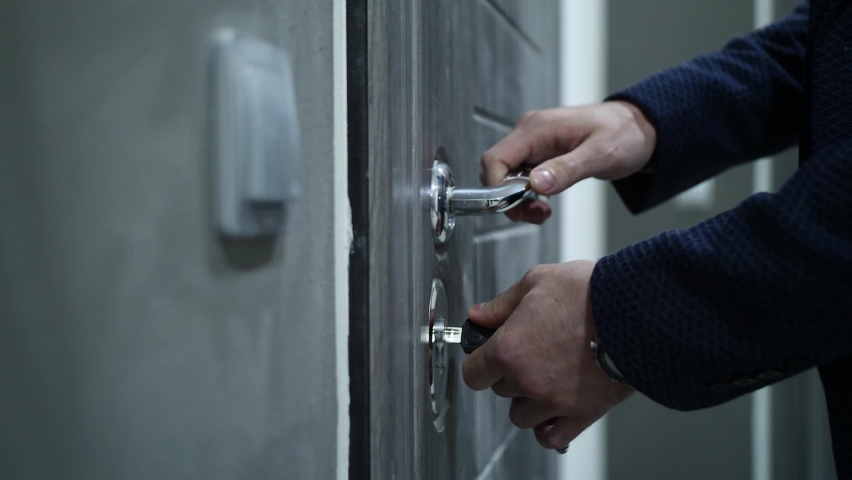 A man opens the front door
