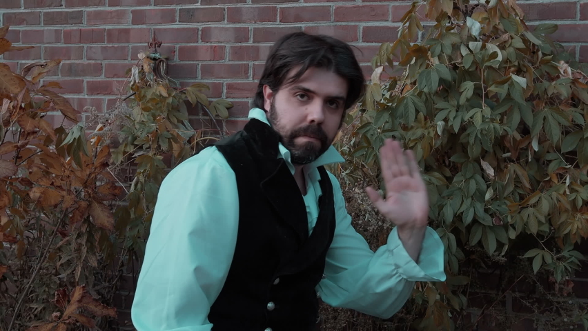 Historic man waving outside at camera, a Person Video by IronStrike