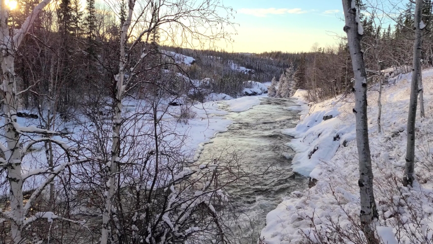 4K video of a flowing near Cameron river falls in the winter time, 