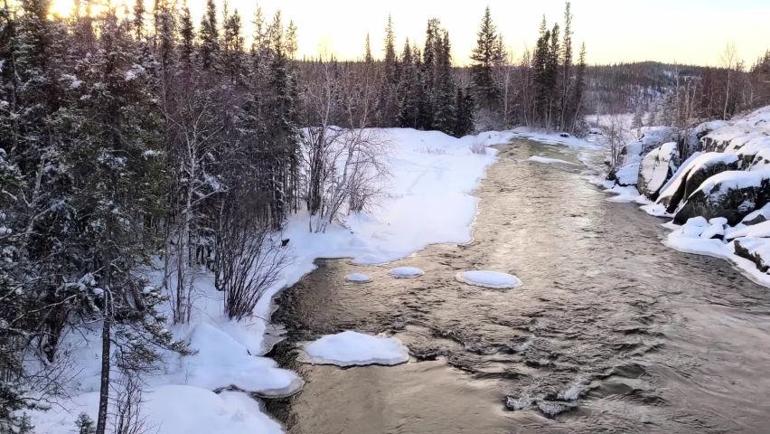 4K video of a flowing near Cameron river falls in the winter time, 