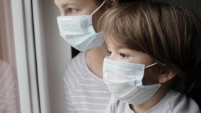  Woman With Her Son, With Protective Mask, Sad Looking Through Window Worried About Covid-19 Lockdown. Family In Protection Mask Looking Out Window Home. Quarantine Coronavirus Social Distancing
 - Powered by Shutterstock - Get 15% off with code: PIKWIZARD15